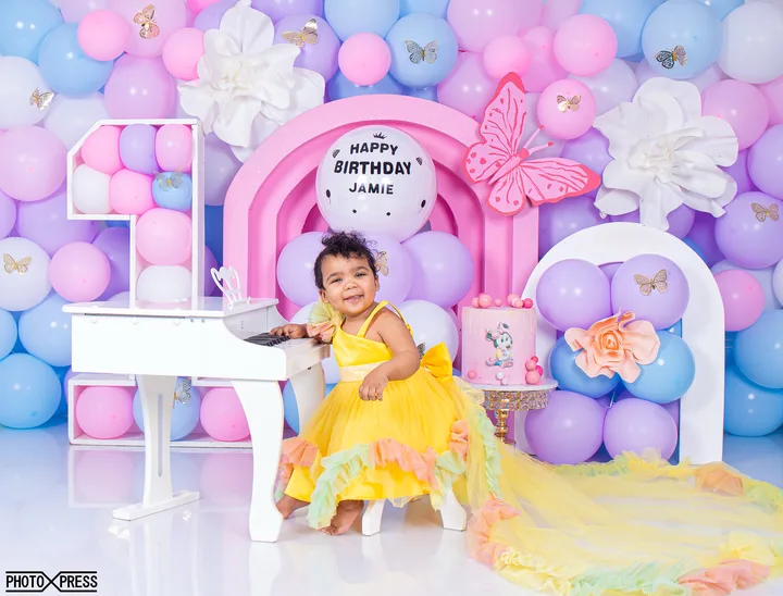 First birthday cake smash photoshoot, pastel butterfly themed balloon arch