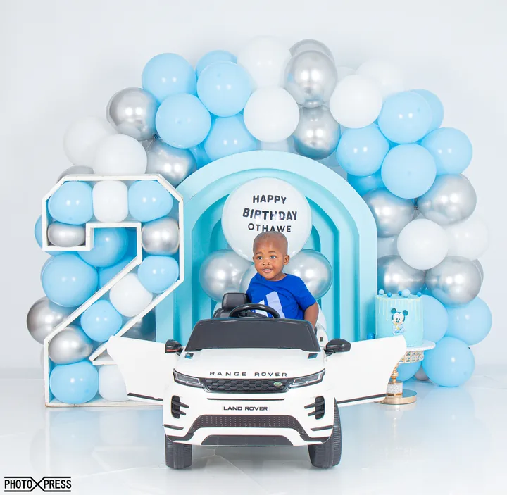 2nd birthday photoshoot at a toy piano, blue and silver theme