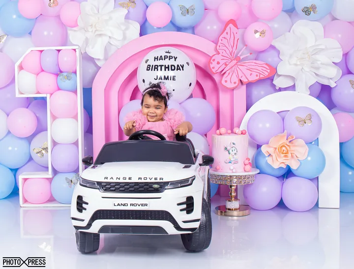 First birthday photoshoot at a toy piano, pastel butterfly theme