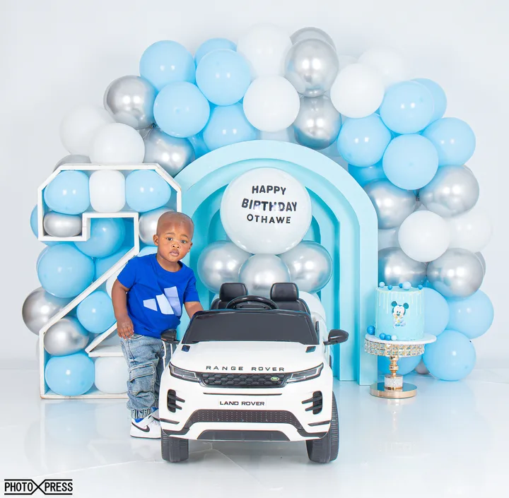 2nd birthday photoshoot at a toy piano, blue and silver theme